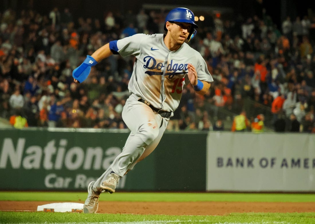Aug 2, 2022; San Francisco, California, USA; Los Angeles Dodgers catcher Austin Barnes (15) rounds third base against the San Francisco Giants during the eighth inning at Oracle Park. Mandatory Credit: Kelley L Cox-USA TODAY Sports