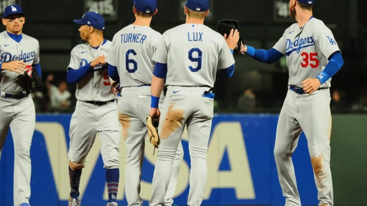 Aug 2, 2022; San Francisco, California, USA; Los Angeles Dodgers players celebrate after a win against the San Francisco Giants at Oracle Park. Mandatory Credit: Kelley L Cox-USA TODAY Sports