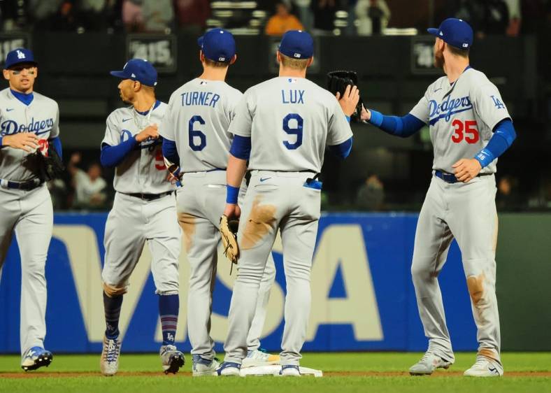 Aug 2, 2022; San Francisco, California, USA; Los Angeles Dodgers players celebrate after a win against the San Francisco Giants at Oracle Park. Mandatory Credit: Kelley L Cox-USA TODAY Sports