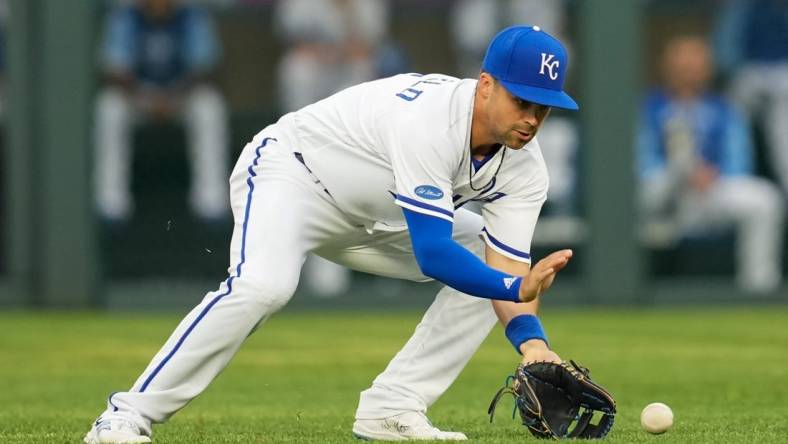 Jul 25, 2022; Kansas City, Missouri, USA; Kansas City Royals second baseman Whit Merrifield (15) fields a ground ball during the first inning against the Los Angeles Angels at Kauffman Stadium. Mandatory Credit: Jay Biggerstaff-USA TODAY Sports