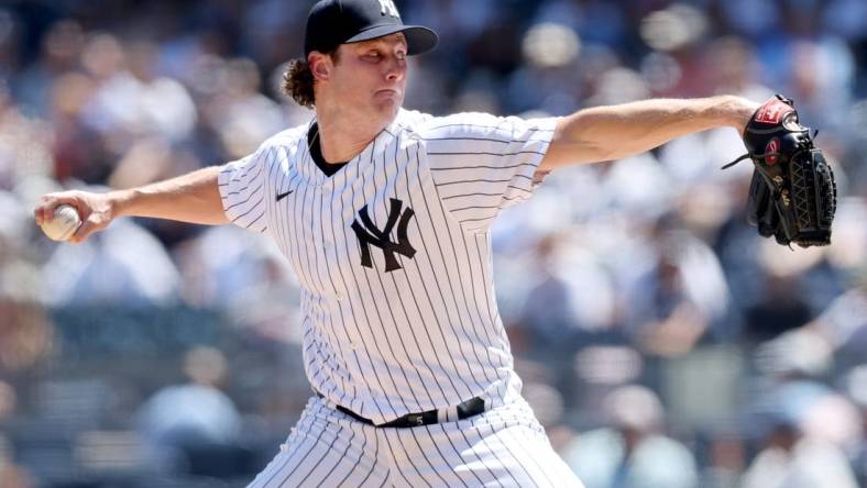 Aug 3, 2022; Bronx, New York, USA; New York Yankees starting pitcher Gerrit Cole (45) pitches against the Seattle Mariners during the first inning at Yankee Stadium. Mandatory Credit: Brad Penner-USA TODAY Sports