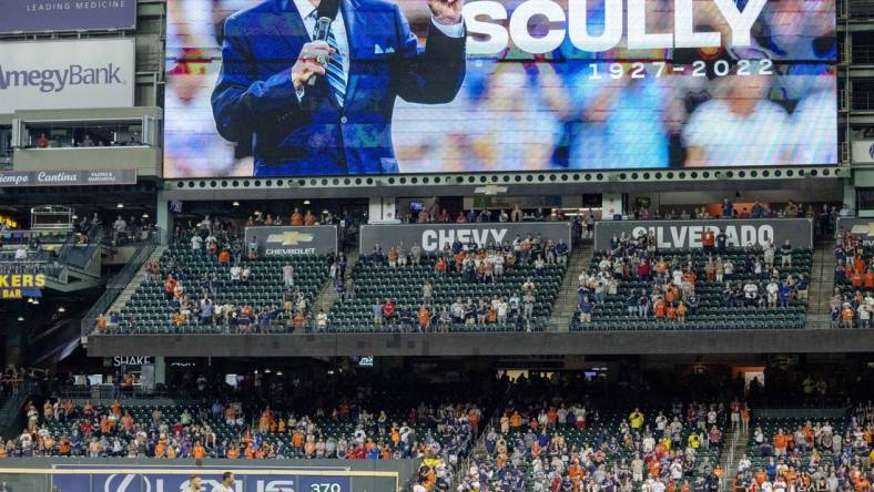 Aug 3, 2022; Houston, Texas, USA; Players and fans stand for a moment of silence for the passing of Vin Scully before the Houston Astros played against the Boston Red Sox at Minute Maid Park. Mandatory Credit: Thomas Shea-USA TODAY Sports