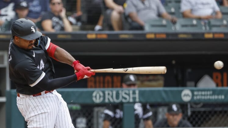 Aug 3, 2022; Chicago, Illinois, USA; Chicago White Sox left fielder Eloy Jimenez (74) breaks his bat on a single against the Kansas City Royals during the third inning at Guaranteed Rate Field. Mandatory Credit: Kamil Krzaczynski-USA TODAY Sports