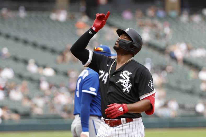 Aug 3, 2022; Chicago, Illinois, USA; Chicago White Sox left fielder Eloy Jimenez (74) reacts after hitting a single against the Kansas City Royals during the fifth inning at Guaranteed Rate Field. Mandatory Credit: Kamil Krzaczynski-USA TODAY Sports