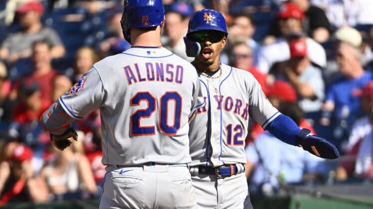 Aug 3, 2022; Washington, District of Columbia, USA; New York Mets first baseman Pete Alonso (20) is congratulated by shortstop Francisco Lindor (12) after hitting a two run home run during the third inning against the Washington Nationals at Nationals Park. Mandatory Credit: Brad Mills-USA TODAY Sports