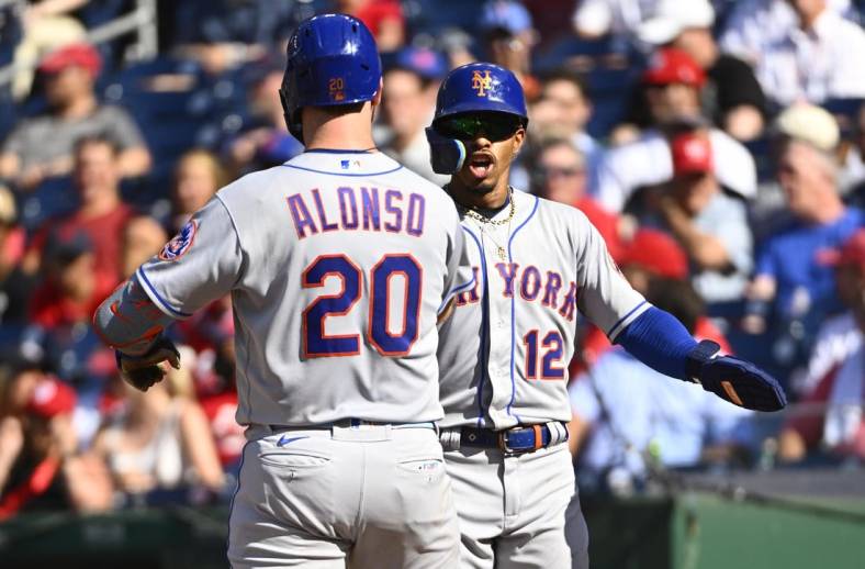 Aug 3, 2022; Washington, District of Columbia, USA; New York Mets first baseman Pete Alonso (20) is congratulated by shortstop Francisco Lindor (12) after hitting a two run home run during the third inning against the Washington Nationals at Nationals Park. Mandatory Credit: Brad Mills-USA TODAY Sports