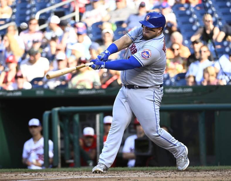 Aug 3, 2022; Washington, District of Columbia, USA; New York Mets designated hitter Daniel Vogelbach (32) hits a grand slam against the Washington Nationals during the fifth inning at Nationals Park. Mandatory Credit: Brad Mills-USA TODAY Sports