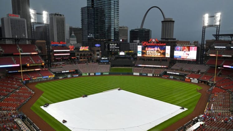 Aug 3, 2022; St. Louis, Missouri, USA;  Rain falls as the tarp covers the field before a game between the St. Louis Cardinals and the Chicago Cubs at Busch Stadium. Mandatory Credit: Jeff Curry-USA TODAY Sports