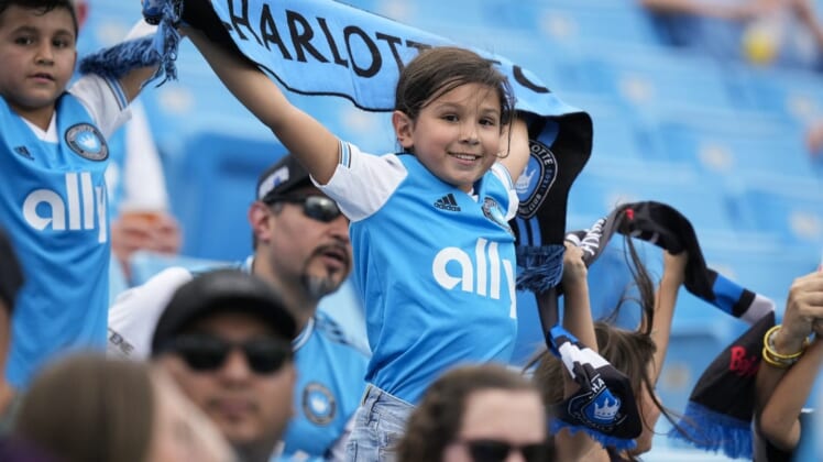Aug 3, 2022; Charlotte, North Carolina, USA; A young Charlotte FC fan shows his colors during the first half against the D.C. United at Bank of America Stadium. Mandatory Credit: Jim Dedmon-USA TODAY Sports