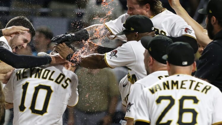 Aug 3, 2022; Pittsburgh, Pennsylvania, USA;  Pittsburgh Pirates center fielder Bryan Reynolds (10) crosses home plate on a game winning walk off home run against the Milwaukee Brewers during the ninth inning at PNC Park. The Pirates won 8-7. Mandatory Credit: Charles LeClaire-USA TODAY Sports