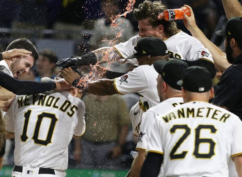 Aug 3, 2022; Pittsburgh, Pennsylvania, USA;  Pittsburgh Pirates center fielder Bryan Reynolds (10) crosses home plate on a game winning walk off home run against the Milwaukee Brewers during the ninth inning at PNC Park. The Pirates won 8-7. Mandatory Credit: Charles LeClaire-USA TODAY Sports