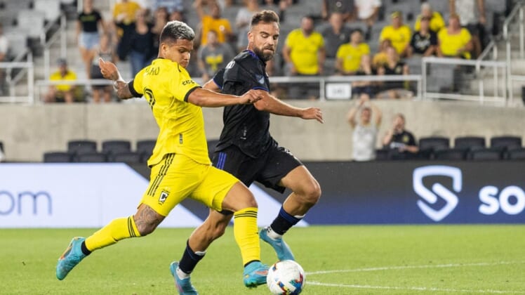 Aug 3, 2022; Columbus, Ohio, USA; Columbus Crew forward Cucho (9) kicks the ball while CF Montreal defender Rudy Camacho (4) defends in the second half at Lower.com Field. Mandatory Credit: Trevor Ruszkowski-USA TODAY Sports