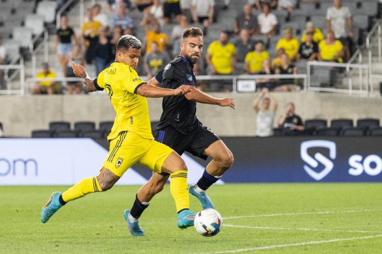 Aug 3, 2022; Columbus, Ohio, USA; Columbus Crew forward Cucho (9) kicks the ball while CF Montreal defender Rudy Camacho (4) defends in the second half at Lower.com Field. Mandatory Credit: Trevor Ruszkowski-USA TODAY Sports