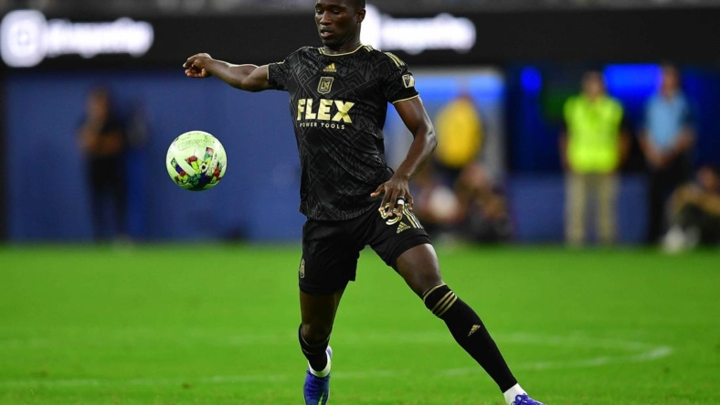 Aug 3, 2022; Los Angeles, California, US; LAFC defender Mamadou Fall (5) moves the ball against Club America during the first half at SoFi Stadium. Mandatory Credit: Gary A. Vasquez-USA TODAY Sports