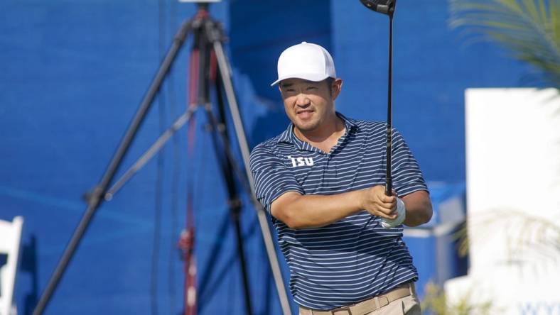 Aug 4, 2022; Greensboro, North Carolina, USA; John Huh watches his tee shot on the tenth tee during the first round of the Wyndham Championship golf tournament. Mandatory Credit: Nell Redmond-USA TODAY Sports