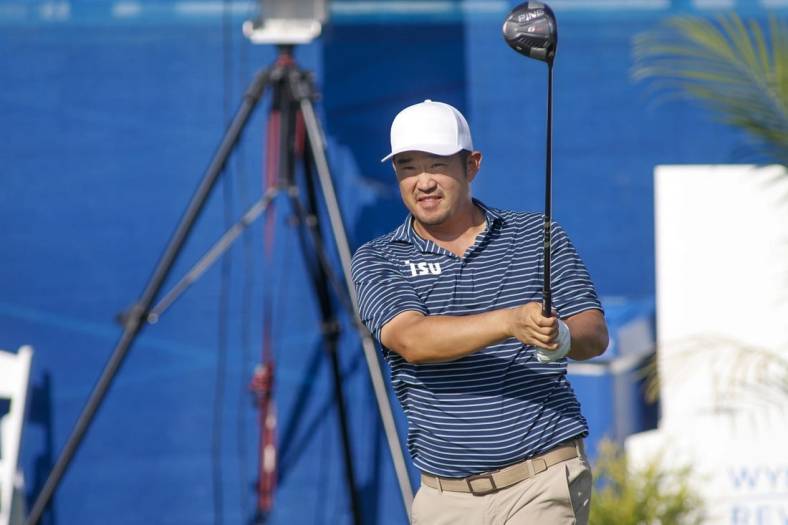 Aug 4, 2022; Greensboro, North Carolina, USA; John Huh watches his tee shot on the tenth tee during the first round of the Wyndham Championship golf tournament. Mandatory Credit: Nell Redmond-USA TODAY Sports