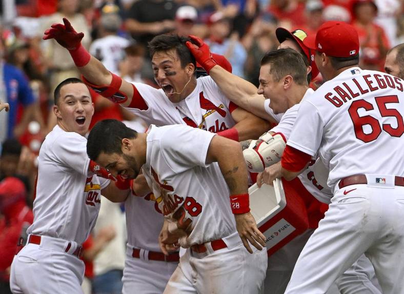 Aug 4, 2022; St. Louis, Missouri, USA;  St. Louis Cardinals right fielder Lars Nootbaar (21) celebrates with teammates after hitting a walk-off one run single against the Chicago Cubs during the ninth inning at Busch Stadium. Mandatory Credit: Jeff Curry-USA TODAY Sports