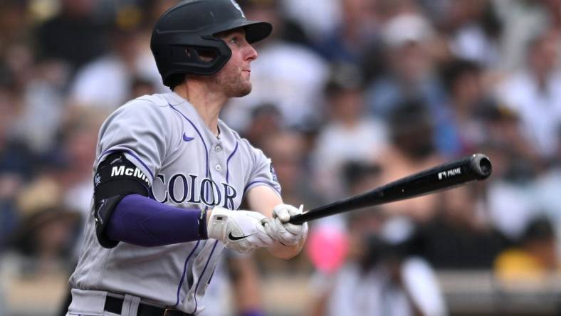 Aug 4, 2022; San Diego, California, USA; Colorado Rockies second baseman Ryan McMahon (24) watches his three-run home run against the San Diego Padres during the fifth inning at Petco Park. Mandatory Credit: Orlando Ramirez-USA TODAY Sports