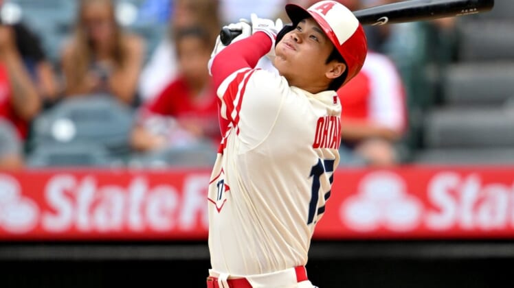 Aug 4, 2022; Anaheim, California, USA; Los Angeles Angels designated hitter Shohei Ohtani (17) strands a runner on base as he pops out for the final out the ninth inning against the Oakland Athletics at Angel Stadium. Mandatory Credit: Jayne Kamin-Oncea-USA TODAY Sports