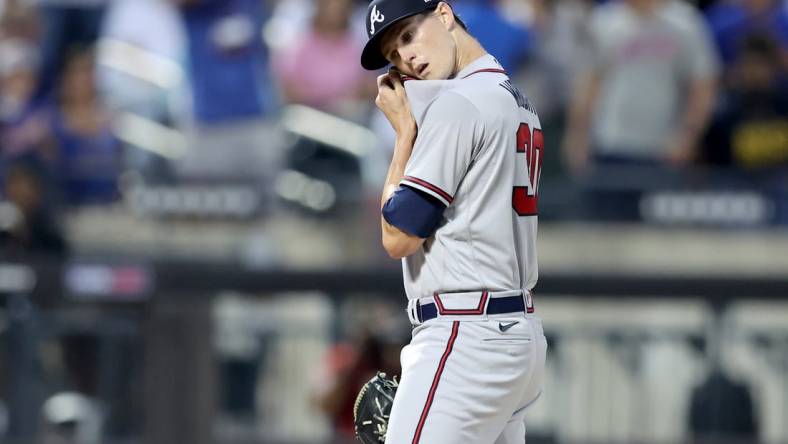 Aug 4, 2022; New York City, New York, USA; Atlanta Braves starting pitcher Kyle Wright (30) reacts during the third inning against the New York Mets at Citi Field. Mandatory Credit: Brad Penner-USA TODAY Sports