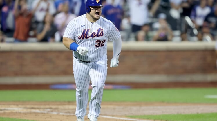Aug 4, 2022; New York City, New York, USA; New York Mets designated hitter Daniel Vogelbach (32) reacts after hitting a solo home run against the Atlanta Braves during the third inning at Citi Field. Mandatory Credit: Brad Penner-USA TODAY Sports