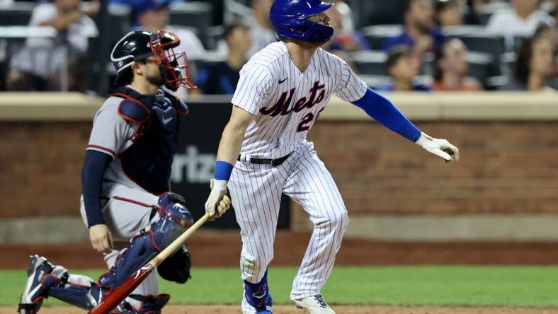 Aug 4, 2022; New York City, New York, USA; New York Mets left fielder Tyler Naquin (25) watches his solo home run against the Atlanta Braves during the sixth inning at Citi Field. Mandatory Credit: Brad Penner-USA TODAY Sports