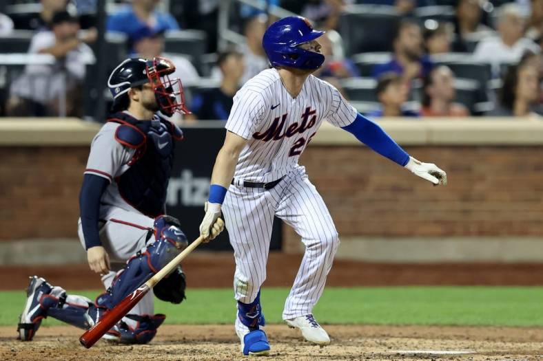 Aug 4, 2022; New York City, New York, USA; New York Mets left fielder Tyler Naquin (25) watches his solo home run against the Atlanta Braves during the sixth inning at Citi Field. Mandatory Credit: Brad Penner-USA TODAY Sports
