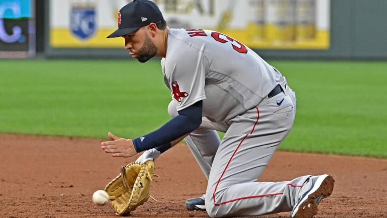 Aug 4, 2022; Kansas City, Missouri, USA; Boston Red Sox first baseman Eric Hosmer (35) fields a ground ball during the third inning against the Kansas City Royals at Kauffman Stadium. Mandatory Credit: Peter Aiken-USA TODAY Sports