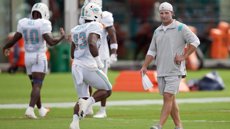 Aug 5, 2022; Miami Gardens, Florida, US; Miami Dolphins wide receivers coach Wes Welker walks on the field during training camp at Baptist Health Training Complex. Mandatory Credit: Jasen Vinlove-USA TODAY Sports