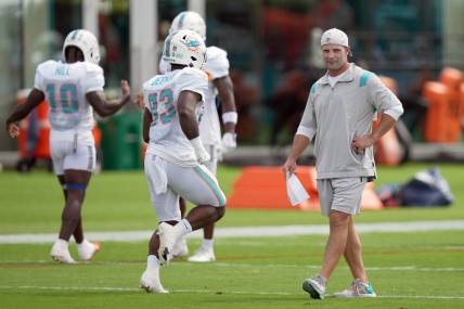 Aug 5, 2022; Miami Gardens, Florida, US; Miami Dolphins wide receivers coach Wes Welker walks on the field during training camp at Baptist Health Training Complex. Mandatory Credit: Jasen Vinlove-USA TODAY Sports