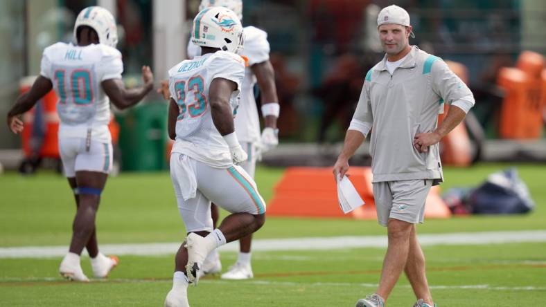 Aug 5, 2022; Miami Gardens, Florida, US; Miami Dolphins wide receivers coach Wes Welker walks on the field during training camp at Baptist Health Training Complex. Mandatory Credit: Jasen Vinlove-USA TODAY Sports