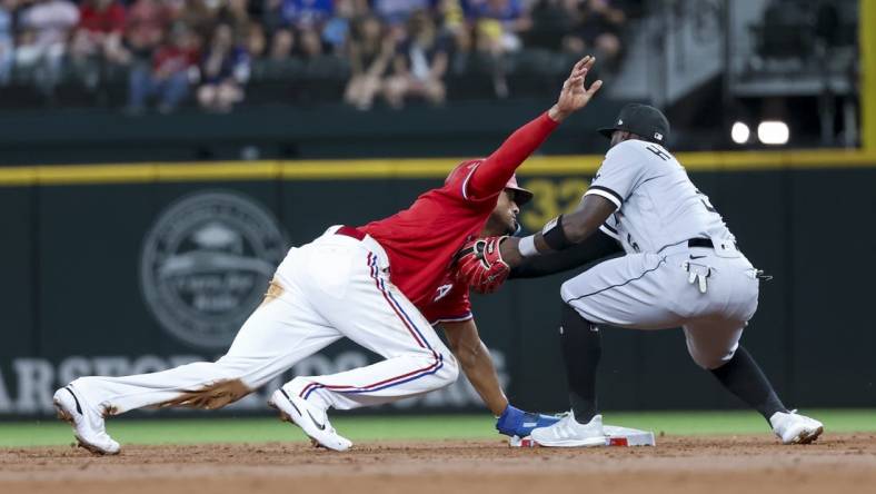 Aug 5, 2022; Arlington, Texas, USA;  Texas Rangers left fielder Bubba Thompson (65) steals second base ahead of the tag by Chicago White Sox second baseman Josh Harrison (5) during the second inning at Globe Life Field. Mandatory Credit: Kevin Jairaj-USA TODAY Sports