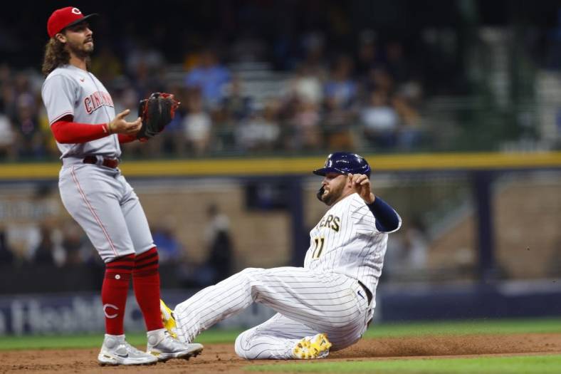 Aug 5, 2022; Milwaukee, Wisconsin, USA;  Milwaukee Brewers first baseman Rowdy Tellez (11) steals second base during the third inning against the Cincinnati Reds at American Family Field. Mandatory Credit: Jeff Hanisch-USA TODAY Sports