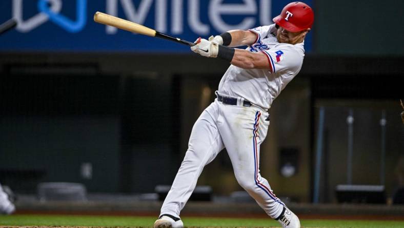 Aug 1, 2022; Arlington, Texas, USA; Texas Rangers right fielder Kole Calhoun (56) in action during the game between the Texas Rangers and the Baltimore Orioles at Globe Life Field. Mandatory Credit: Jerome Miron-USA TODAY Sports