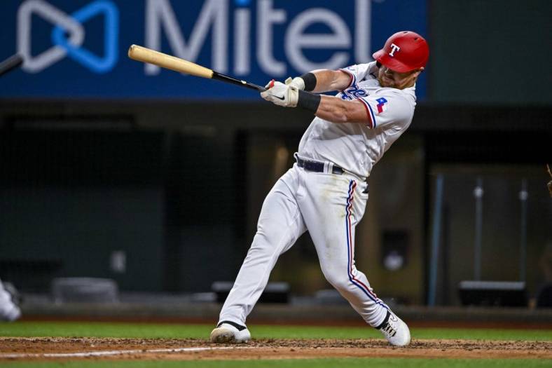 Aug 1, 2022; Arlington, Texas, USA; Texas Rangers right fielder Kole Calhoun (56) in action during the game between the Texas Rangers and the Baltimore Orioles at Globe Life Field. Mandatory Credit: Jerome Miron-USA TODAY Sports