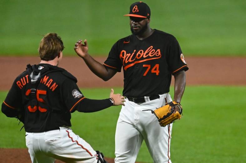 Aug 5, 2022; Baltimore, Maryland, USA;  Baltimore Orioles relief pitcher Felix Bautista (74) celebrates with  catcher Adley Rutschman (35) after the game against the Pittsburgh Pirates at Oriole Park at Camden Yards. Mandatory Credit: Tommy Gilligan-USA TODAY Sports