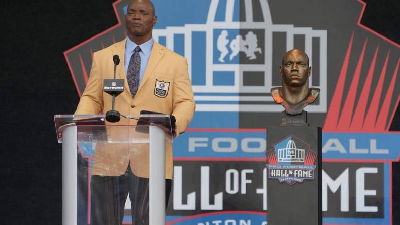 Aug 6, 2022; Canton, OH, USA; Bryant Young speaks during the Pro Football Hall of Fame Class of 2022 enshrinement  ceremony at Tom Benson Hall of Fame Stadium. Mandatory Credit: Kirby Lee-USA TODAY Sports