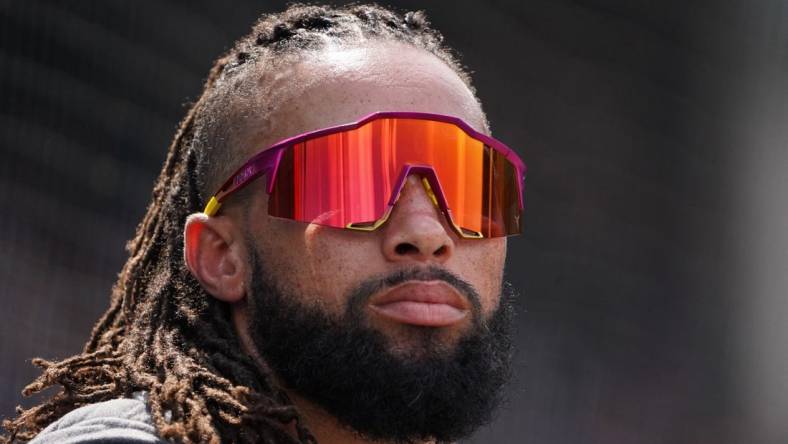 Aug 6, 2022; Chicago, Illinois, USA; Miami Marlins left fielder Billy Hamilton (6) in the dugout during the fourth inning against the Chicago Cubs at Wrigley Field. Mandatory Credit: David Banks-USA TODAY Sports