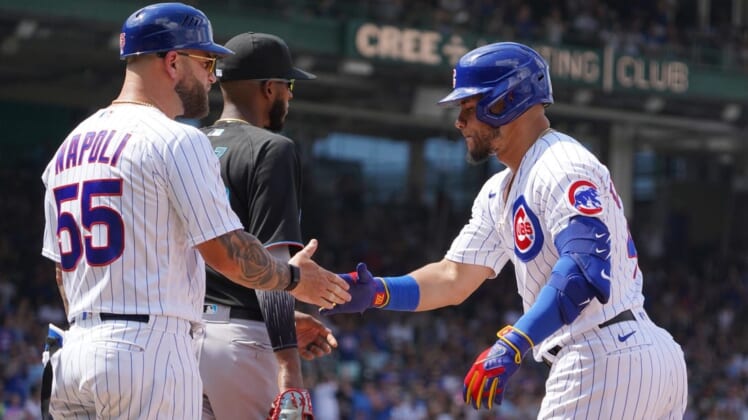 Aug 6, 2022; Chicago, Illinois, USA; Chicago Cubs designated hitter Willson Contreras (40) is greeted by  first base coach Mike Napoli (55) after hitting a one run single against the Miami Marlins during the fifth inning at Wrigley Field. Mandatory Credit: David Banks-USA TODAY Sports