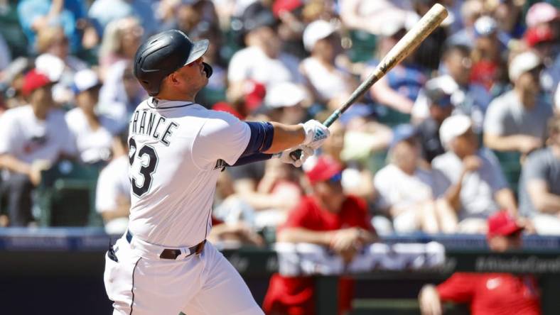 Aug 6, 2022; Seattle, Washington, USA; Seattle Mariners first baseman Ty France (23) hits a two-run home run against the Los Angeles Angels during the third inning at T-Mobile Park. Mandatory Credit: Joe Nicholson-USA TODAY Sports