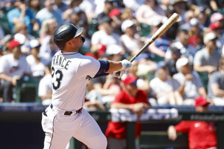 Aug 6, 2022; Seattle, Washington, USA; Seattle Mariners first baseman Ty France (23) hits a two-run home run against the Los Angeles Angels during the third inning at T-Mobile Park. Mandatory Credit: Joe Nicholson-USA TODAY Sports