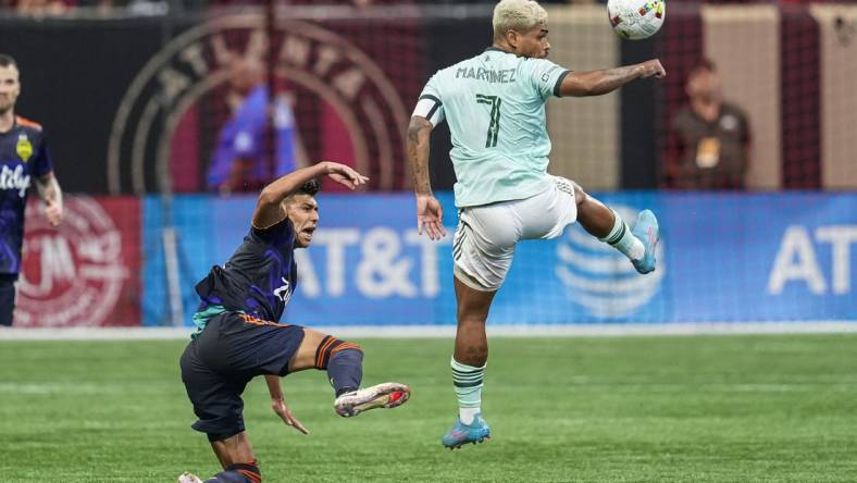 Aug 6, 2022; Atlanta, Georgia, USA; Seattle Sounders defender Xavier Arreaga (3) is able to move the ball past Atlanta United forward Josef Martinez (7) during the second half at Mercedes-Benz Stadium. Mandatory Credit: Dale Zanine-USA TODAY Sports