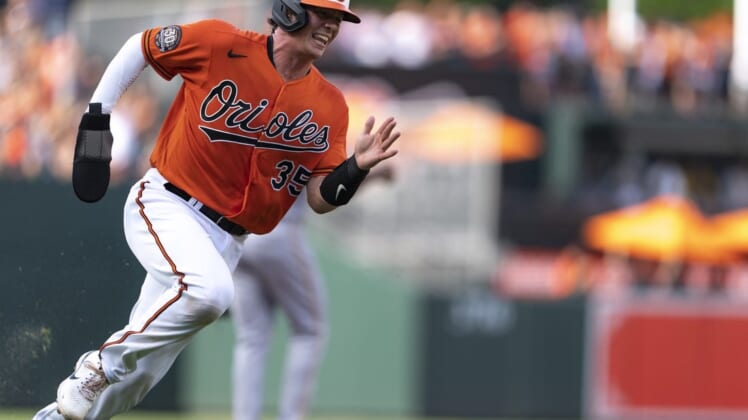 Aug 6, 2022; Baltimore, Maryland, USA; Baltimore Orioles catcher Adley Rutschman (35) rounds third base to score a run in the first inning  at Oriole Park at Camden Yards. Mandatory Credit: Brent Skeen-USA TODAY Sports