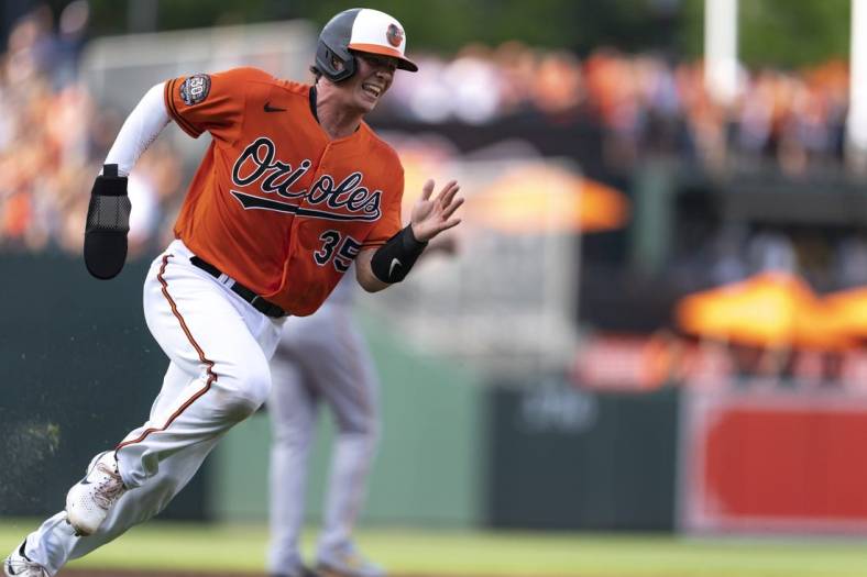 Aug 6, 2022; Baltimore, Maryland, USA; Baltimore Orioles catcher Adley Rutschman (35) rounds third base to score a run in the first inning  at Oriole Park at Camden Yards. Mandatory Credit: Brent Skeen-USA TODAY Sports