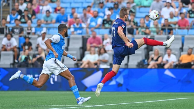 Aug 6, 2022; Charlotte, North Carolina, USA; Chicago Fire attacker Kacper Przybylko (11) controls the ball in front of Charlotte FC defender Anton Walkes (left) in the first half at Bank of America Stadium. Mandatory Credit: Griffin Zetterberg-USA TODAY Sports