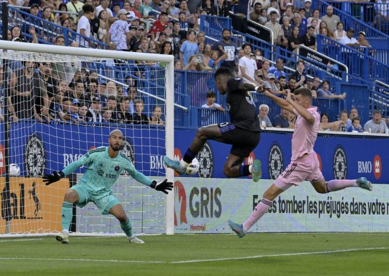 Aug 6, 2022; Montreal, Quebec, CAN; CF Montreal midfielder Romell Quioto (30) scores a goal against Inter Miami CF goalkeeper Drake Callender (27) during the first half at Stade Saputo. Mandatory Credit: Eric Bolte-USA TODAY Sports