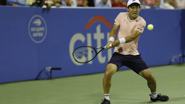 Aug 6, 2022; Washington, DC, USA; Yoshihito Nishioka (JPN) hits a backhand against Andrey Rublev (not pictured) in a men's single's semifinal on day six of the Citi Open at Rock Creek Park Tennis Center. Mandatory Credit: Geoff Burke-USA TODAY Sports