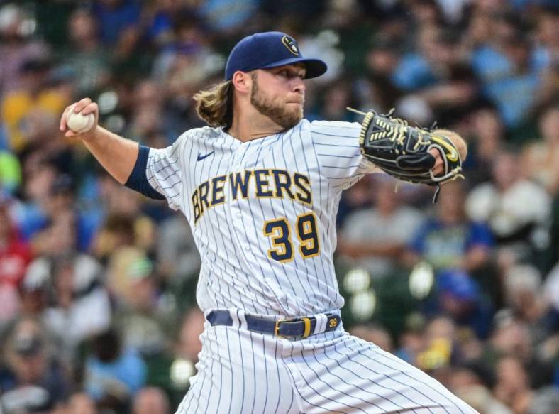 Aug 7, 2022; Milwaukee, Wisconsin, USA;  Milwaukee Brewers pitcher Corbin Burnes (39) throws a pitch in the first inning against the Cincinnati Reds at American Family Field. Mandatory Credit: Benny Sieu-USA TODAY Sports