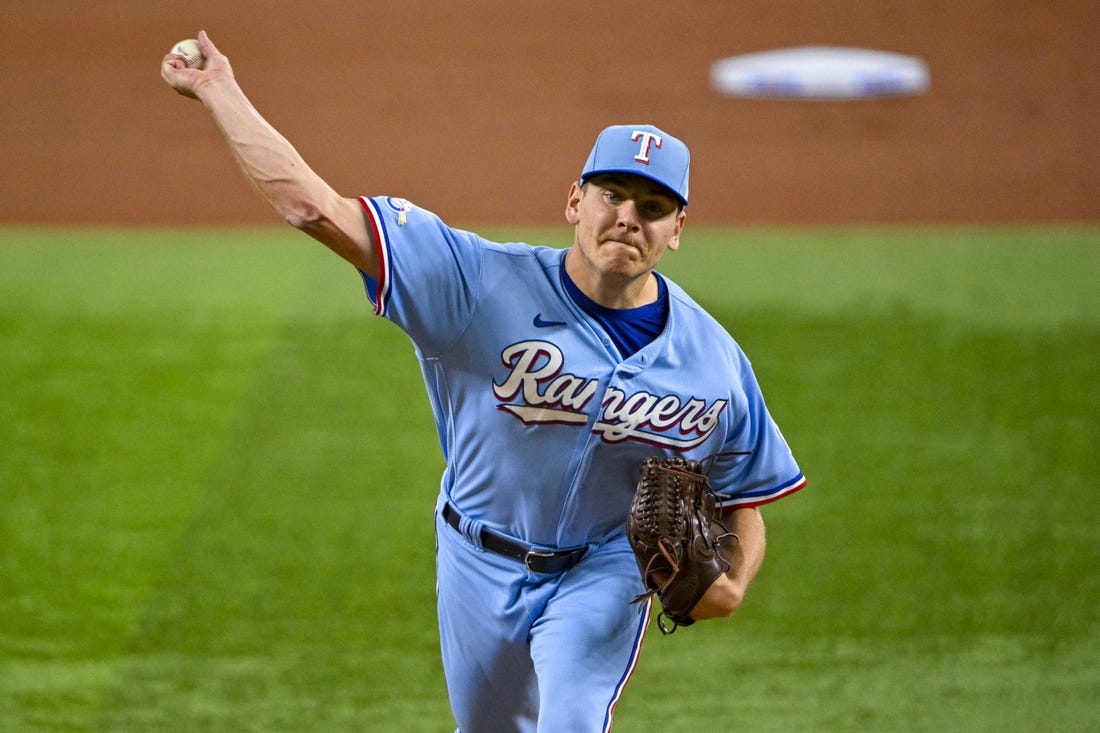 Aug 7, 2022; Arlington, Texas, USA; Texas Rangers starting pitcher Spencer Howard (31) pitches against the Chicago White Sox during the first inning at Globe Life Field. Mandatory Credit: Jerome Miron-USA TODAY Sports