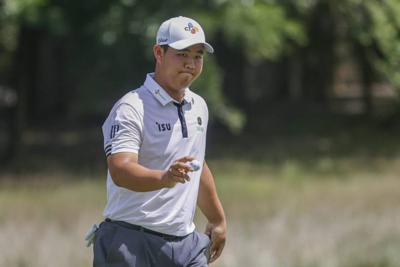 Aug 7, 2022; Greensboro, North Carolina, USA; Joohyung Kim reacts after making a birdie on the eighth hole during the final round of the Wyndham Championship golf tournament. Mandatory Credit: Nell Redmond-USA TODAY Sports